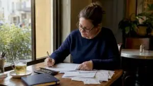 Sole trader reviewing UK tax paperwork at home