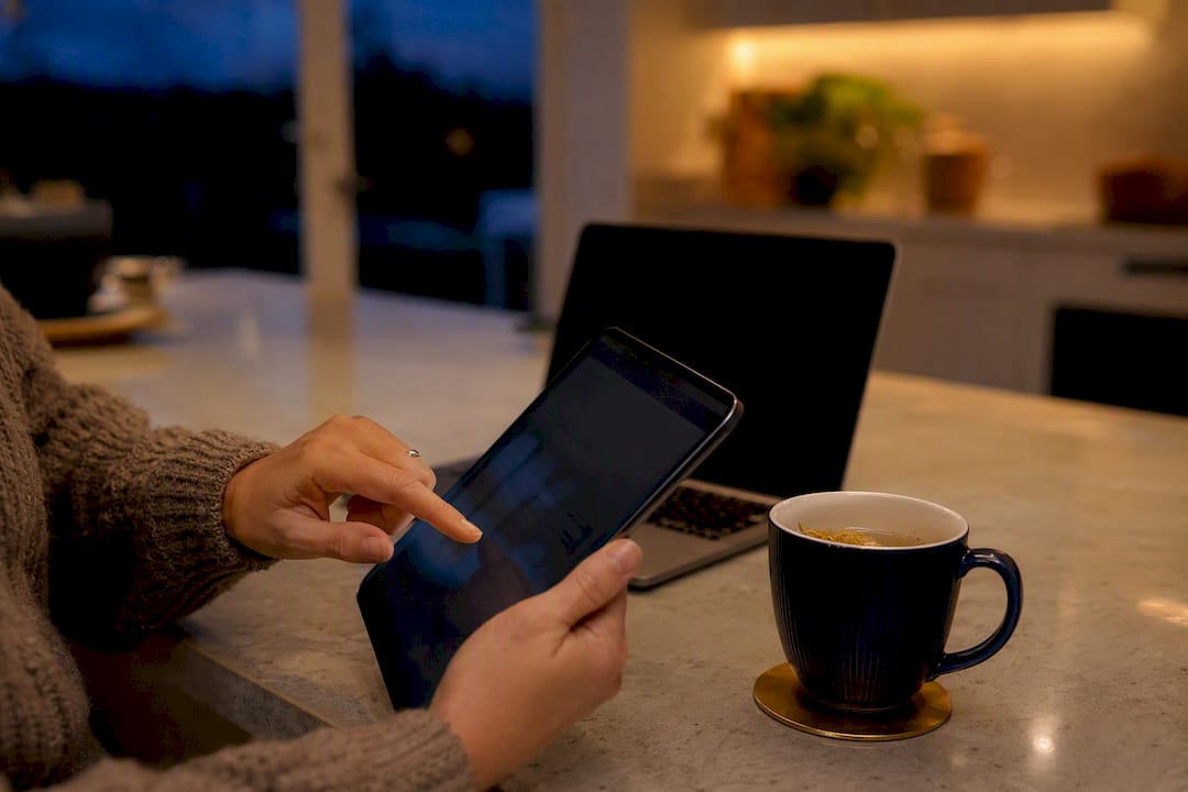 Hand holding smartphone for accounting app setup